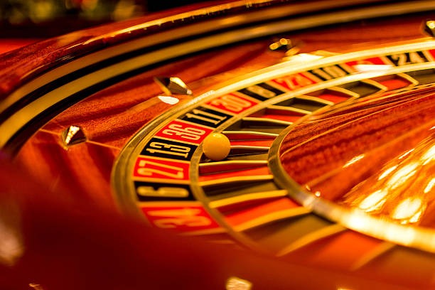 Joker Gaming spin interface showing balance, bet controls, and paytable on bola388